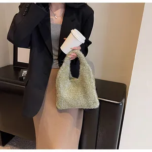 Detail of champagne gold sequin hobo bag shown in a stylish urban fashion lifestyle setting