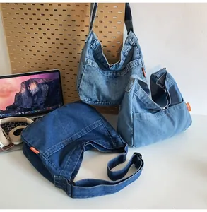 Detailed comparison of three denim crossbody bags in dark, medium, and light blue shades