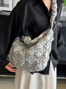 Silver quilted cloud tote bag with pleated metallic finish and adjustable shoulder strap