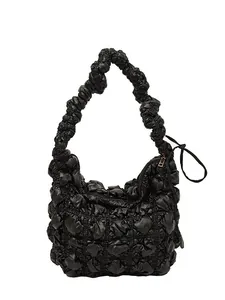 Fashionable black pleated cloud hobo bag with quilted texture and gold zipper puller