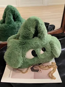 Simpatica borsa in peluche verde con occhi grandi e catena dorata spessa