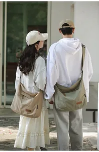 Detailed outdoor shot showing khaki and green nylon crossbody bags on models