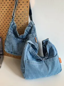 Retro washed denim crossbody bag for couples featuring side pockets and wide straps