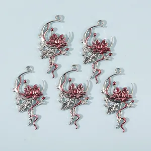 Close-up of five silver-tone lotus moon pendants for DIY jewelry making accessories