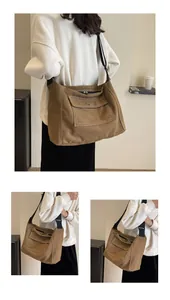 Detail of vintage brown canvas tote with white stitching and spacious inner compartment