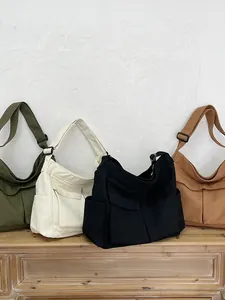 Grande borsa a tracolla in tela con tasche multiple in quattro colori per studenti