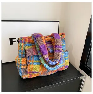 Detailed view of colorful lamb wool tote bag with vibrant plaid pattern and fuzzy texture