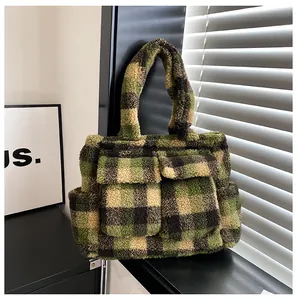 Detailed macro view of plush checkered tote bag featuring front flap pockets and soft texture