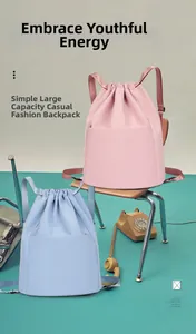 Front detail of pink and blue nylon drawstring backpacks with large capacity compartments