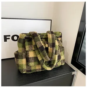Close-up of fluffy green and black checkerboard plush tote bag with soft wool-like texture