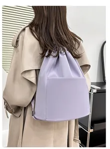 Modern light purple nylon drawstring backpack shown on a model for travel and yoga use