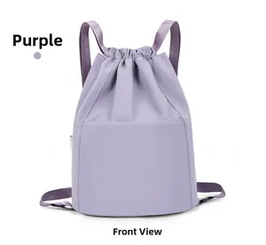 Front view of a purple lightweight nylon drawstring backpack with a flat front pocket