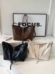 Minimalist PU leather tote bag in black, brown and beige with contrast stitching details