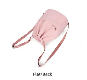 Rear view flat lay of pink nylon drawstring backpack with adjustable straps and zipper pocket