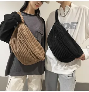 Detail of corduroy crossbody bags in brown and black showing thick ribbed texture and straps
