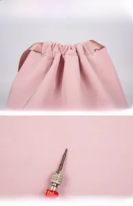 Detail view of durable pink nylon drawstring bag showing scratch-resistant fabric texture