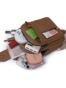 Brown PU leather crossbody chest bag with woven strap and multiple zip compartments