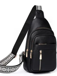 Black pebbled PU leather sling bag with gold zippers and ethnic patterned strap