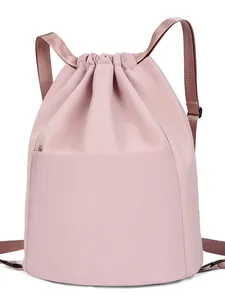 Lightweight pink nylon drawstring backpack for travel and yoga with front zipper pocket