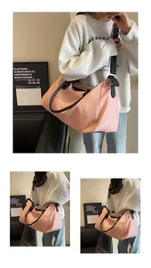 Pink large capacity travel bag with waterproof nylon fabric and detachable shoulder strap