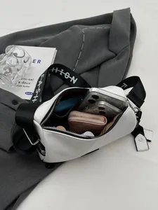 White cylinder crossbody bag with wide letter-print shoulder strap and leather texture
