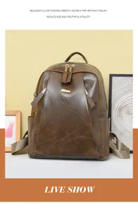 Close-up of brown PU leather backpack with geometric embossed texture and metal zipper