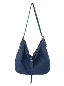Large denim tote bag in dark blue with metallic eyelets and casual hobo crescent shape