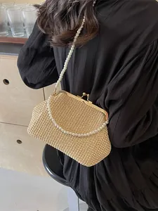 Chic beige woven shell bag with vintage gold clasp and elegant pearl crossbody straps