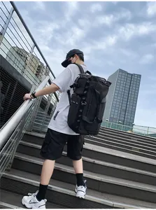Side view of a black tactical travel backpack with durable nylon and multiple pockets