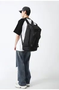 Detail view of large capacity black fitness backpack with wide padded straps and D-rings