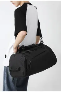 Side view of black large capacity gym bag with durable shoulder strap and carry handles