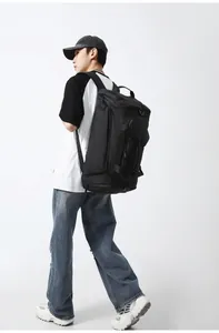 Close-up of matte waterproof black fitness bag with dual shoulder straps and side handle