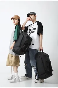 Dual-use black travel bag with waterproof fabric and adjustable shoulder straps