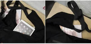 Detail view showing large capacity for iPad and A4 magazine in black crossbody bag