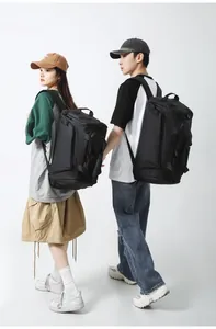 Front view of large capacity black fitness travel backpacks worn by two models