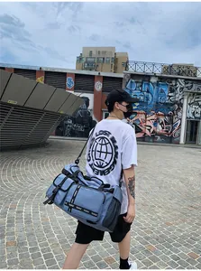 Blue large travel bag with side breathable mesh pocket and adjustable strap on person
