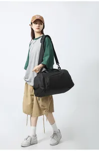 Large capacity waterproof black duffel bag with adjustable shoulder straps for travel