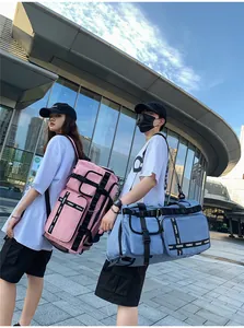Detail of pink and blue travel bags featuring durable water-resistant nylon and adjustable straps