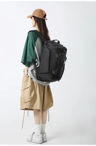 Detail of multi-functional black travel backpack with durable handles and compartments