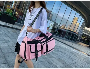 Pink waterproof travel bag showing high-capacity compartments and durable buckle details