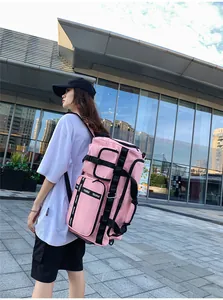 Pink waterproof travel backpack with side zipper compartments for gym and outdoor use
