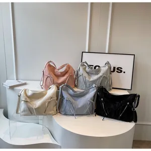 Variety of colors showing bow-knot hobo bags in pink, silver, white, blue, and black