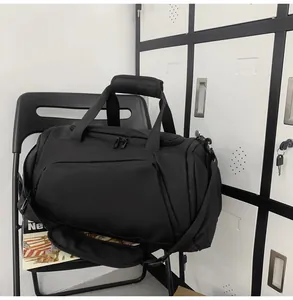 Detail of waterproof nylon gym bag with padded handles and adjustable shoulder strap