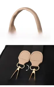 Détail de la poignée en cuir et du crochet métallique amovible du sac à dos noir