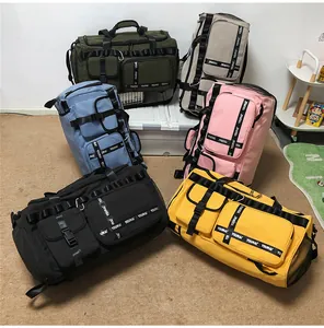 Multiple colors of large travel bags showing durable nylon material and various pockets