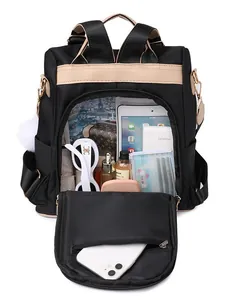 Sac à dos antivol léger noir pour femmes à grande capacité avec charmant pompon blanc