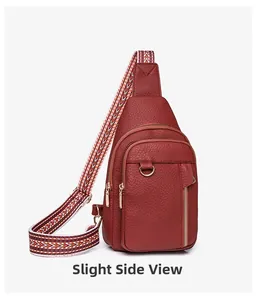Side view of burgundy crossbody chest bag with textured leather and patterned strap
