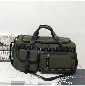 Close-up of military green tactical travel bag featuring functional pockets and nylon straps