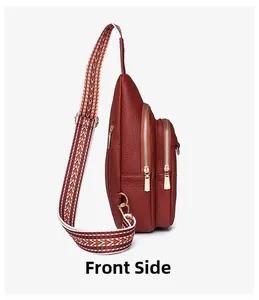 Side view of burgundy leather crossbody bag with ethnic woven strap and golden zippers