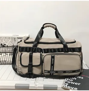 Detail view of large travel bag with multiple pockets and durable nylon fabric
